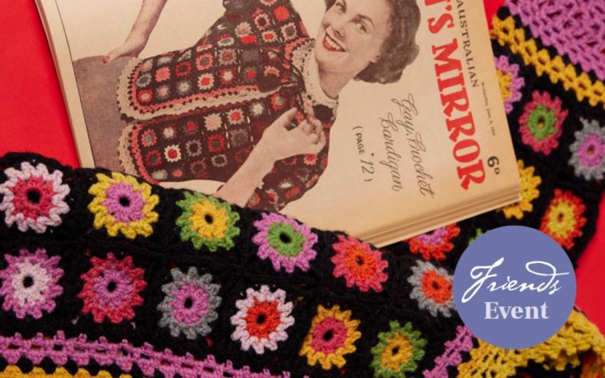Close up of book and colourful crochet blanket